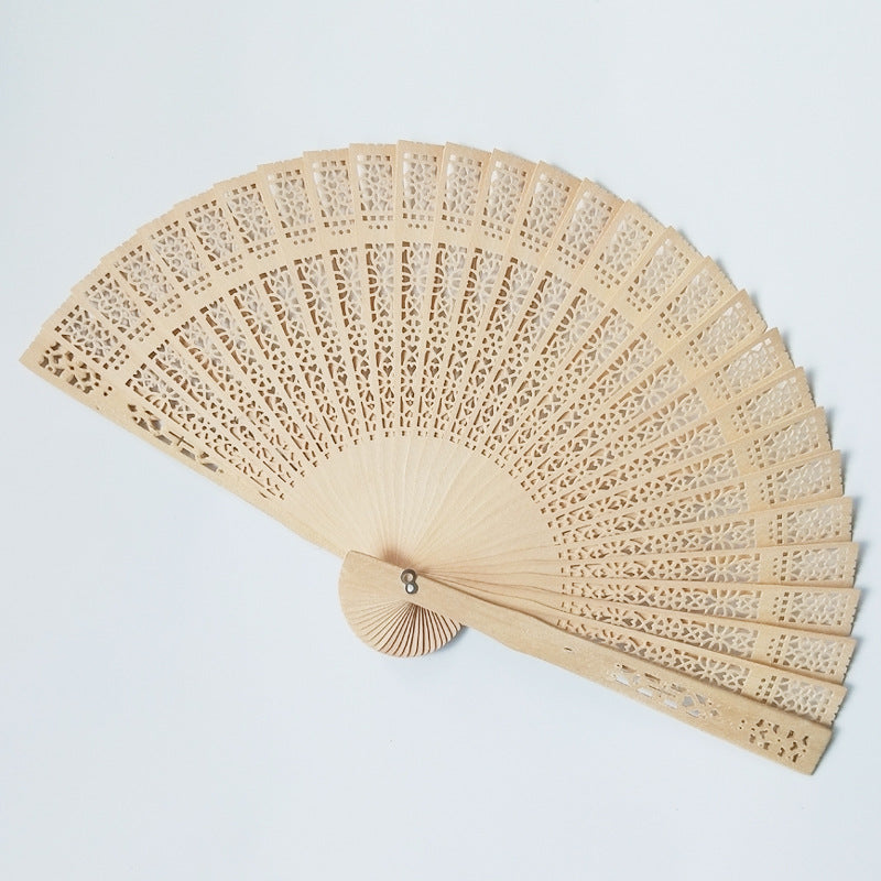 Women's fan made of elegant, intricately perforated material Bowlift