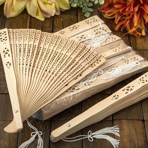 Ladies elegant fan made of high-quality plastic with artistic cutouts Bowlift