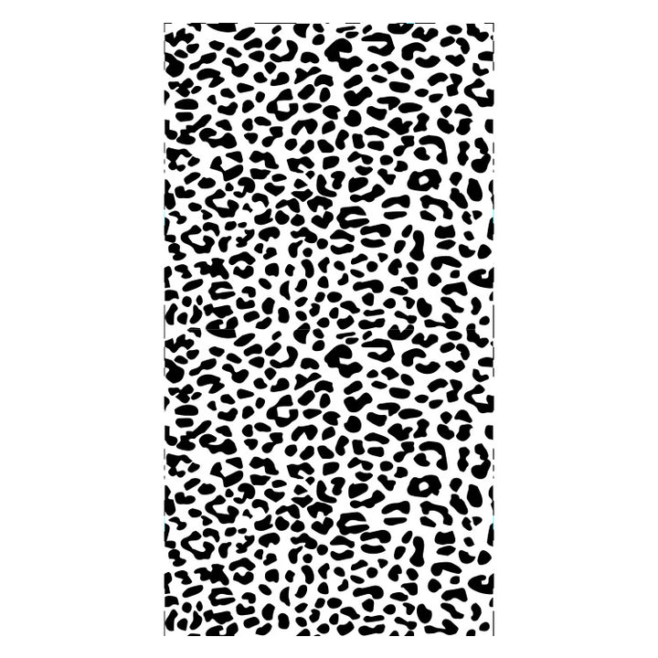 Beach towel with striking leopard motif and colorful accents Bowlift