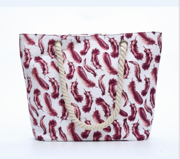Beach bag with playful feather pattern Bowlift