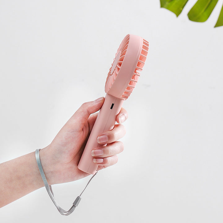 Unisex portable battery-operated mini hand fan with one-button operation and protected fan grill Bowlift