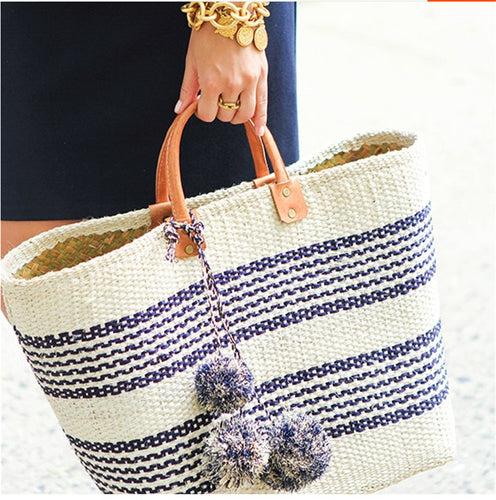 Stylish basket bag with playful pompons Bowlift