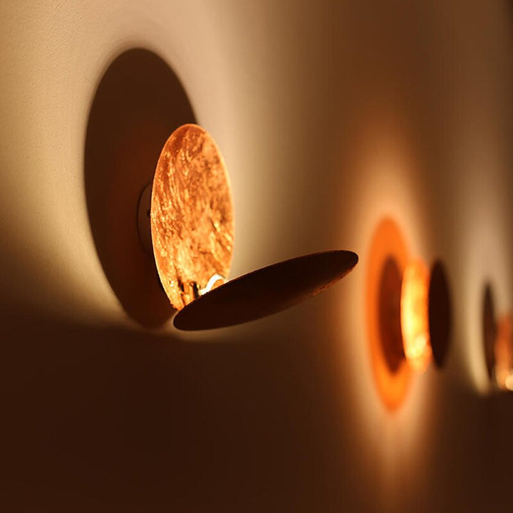 BowLift | Eclipse lamp | Wall light with rotatable golden discs