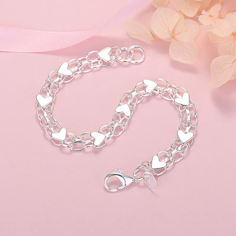 Elegant Luxury Silver Heart Bracelet – Timeless and Chic Bowlift