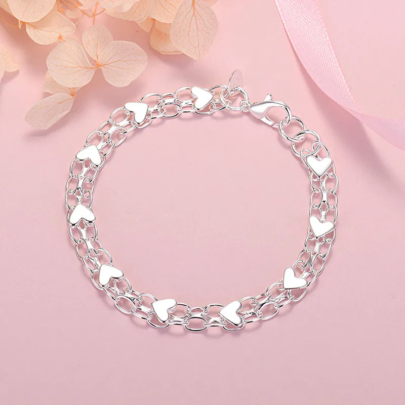 Elegant Luxury Silver Heart Bracelet – Timeless and Chic Bowlift