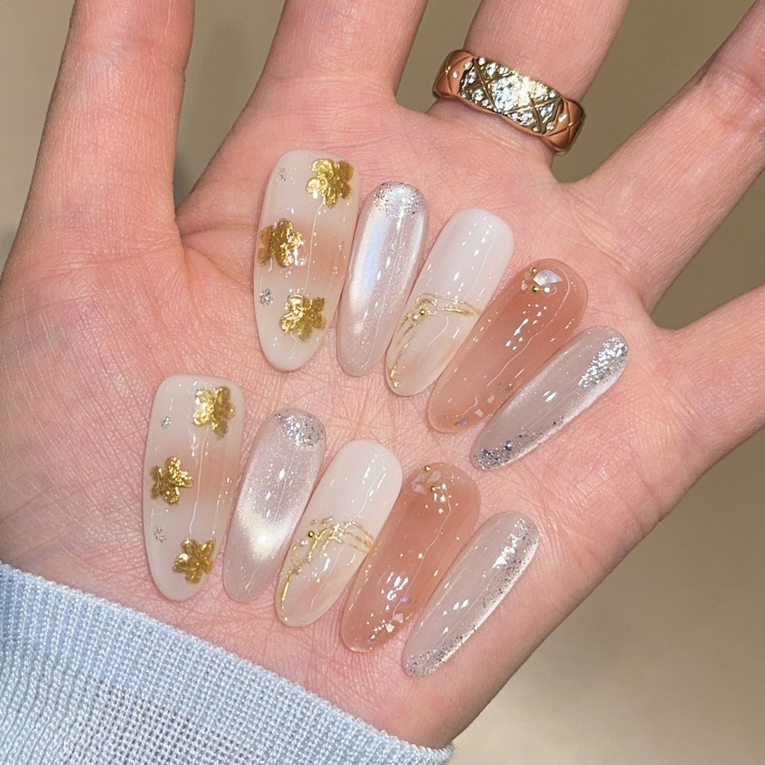 Artificial nails with floral decorations and glitter effects Bowlift