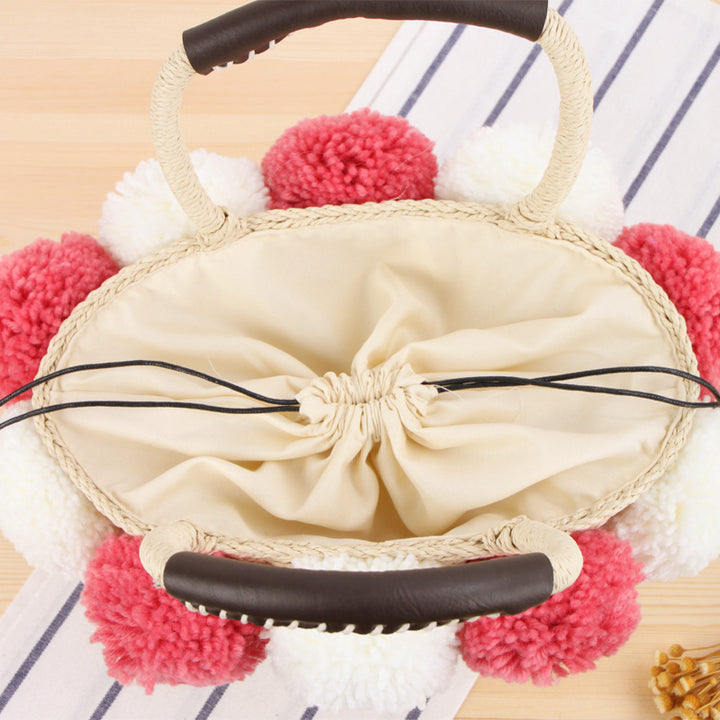 Basket bag with decorative pompons Bowlift