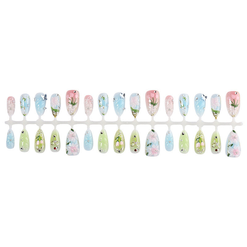 Creative nail set with hand-drawn floral patterns and glitter accents Bowlift