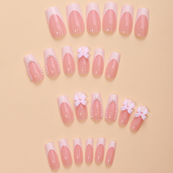 Artificial nails with delicate flower and pearl embellishments Bowlift