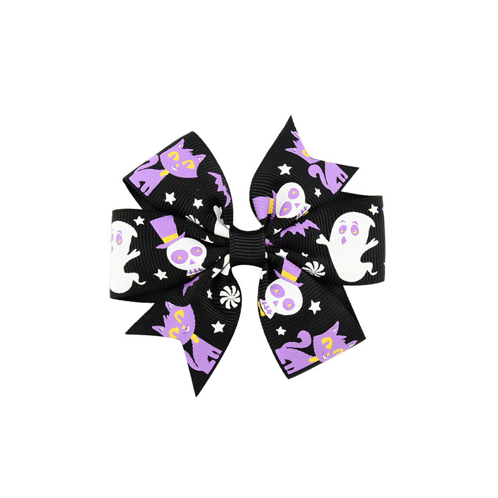Halloween bow with pumpkin and witch motifs