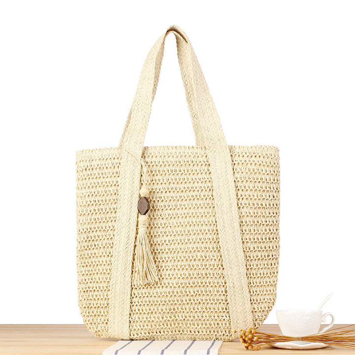 Eco-friendly straw tote bag with elegant tassel detail Bowlift