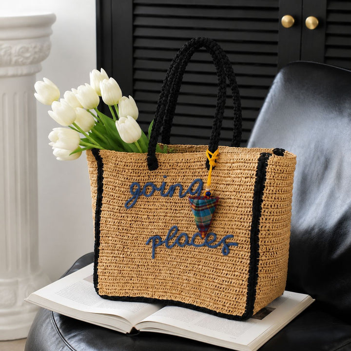 Leisure bag made of woven natural material with colorful pendant Bowlift