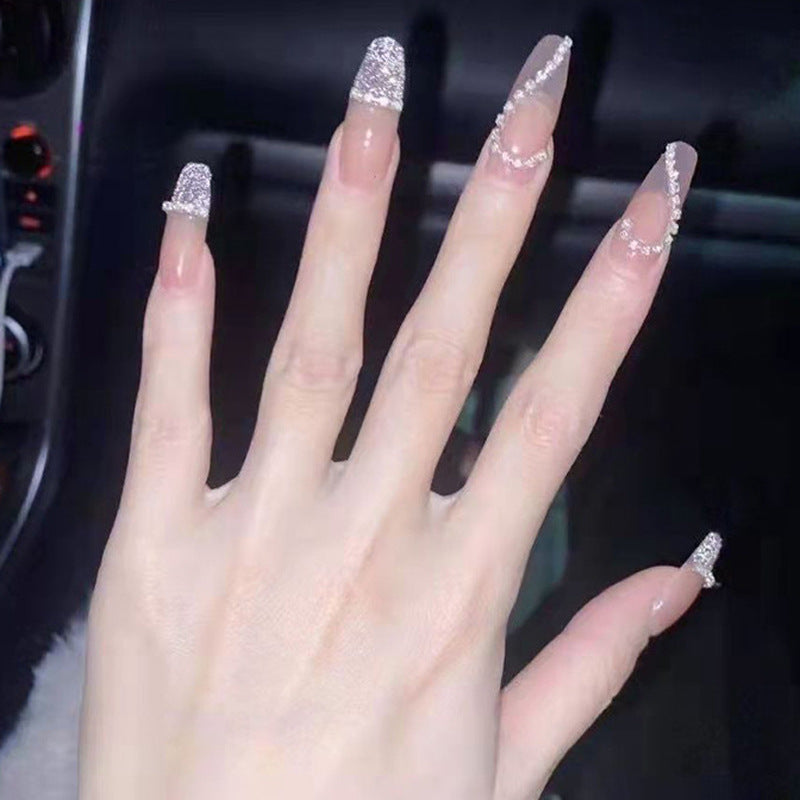 Glamorous artificial nails with heart and glitter design Bowlift