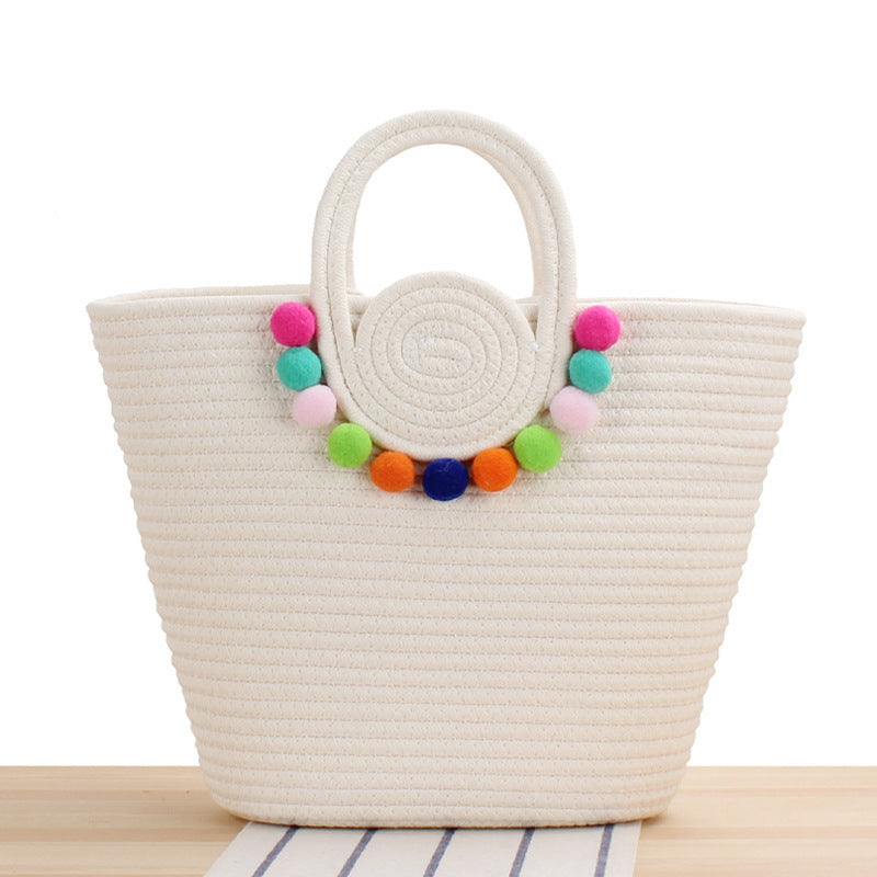 Playful beach bag with colorful pompom decor Bowlift