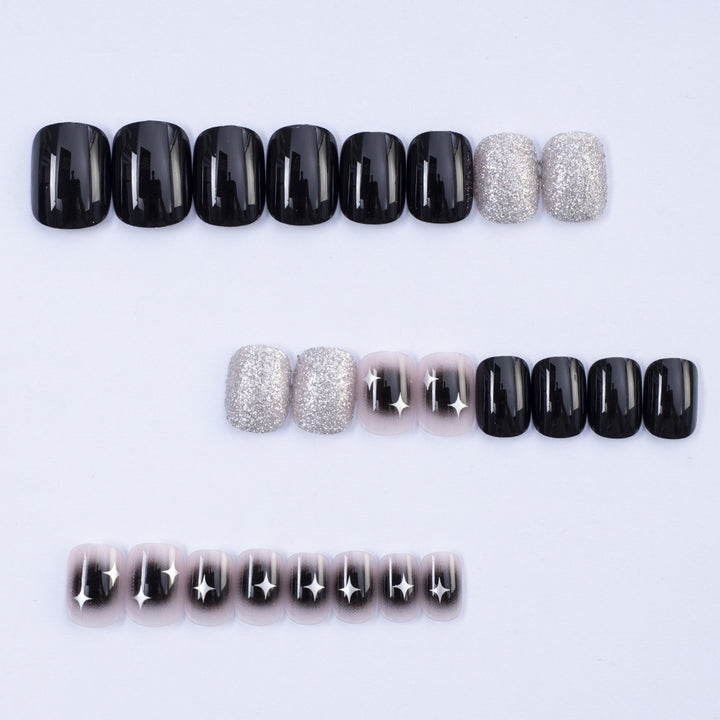 Artificial nails in elegant black with gloss and creative accents Bowlift
