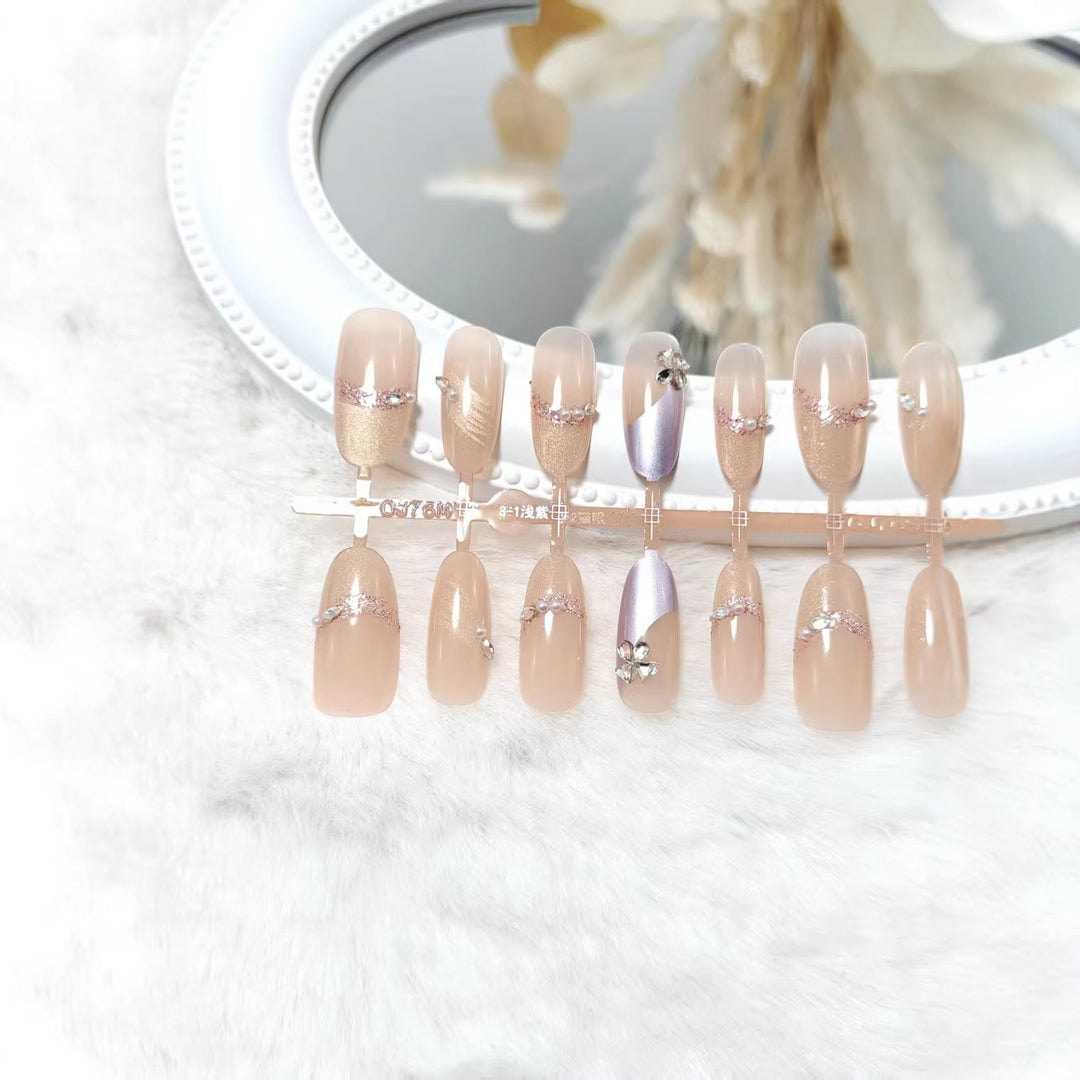 Artificial nails with modern glitter and stone embellishments Bowlift