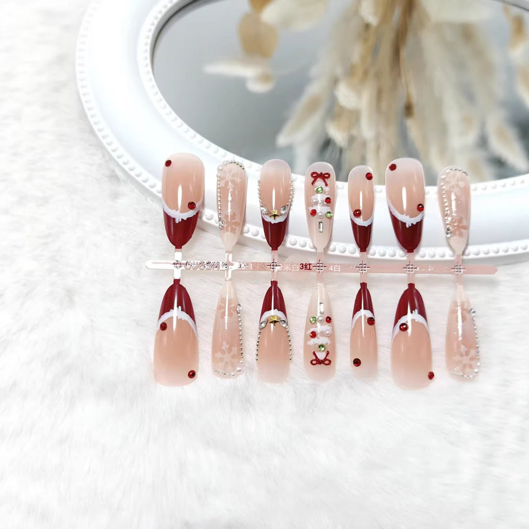 Artificial nails with festive designs and glitter accents Bowlift