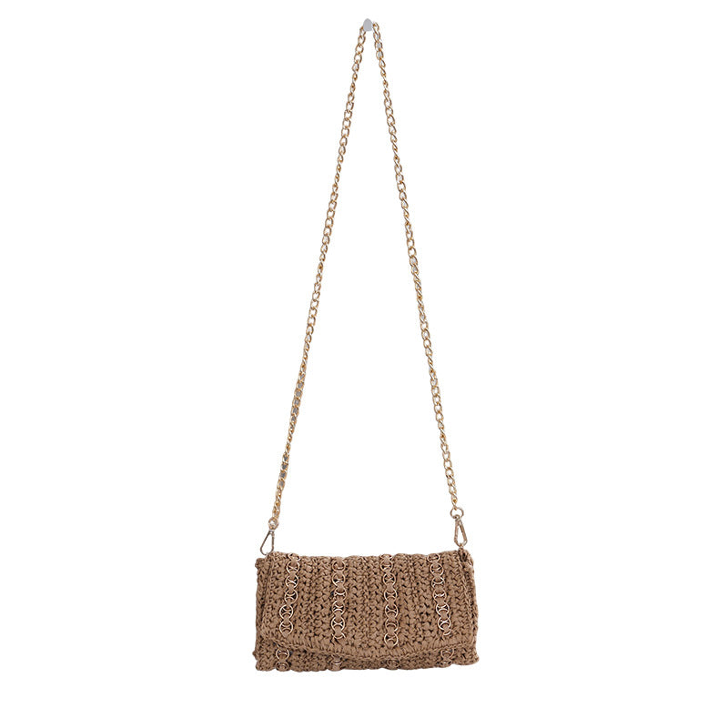 Clutch with chain shoulder strap and handcrafted macrame closure Bowlift
