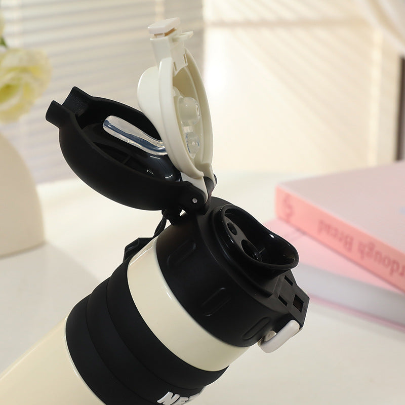 Insulated drinking bottle with a cute character design and practical carrying strap Bowlift