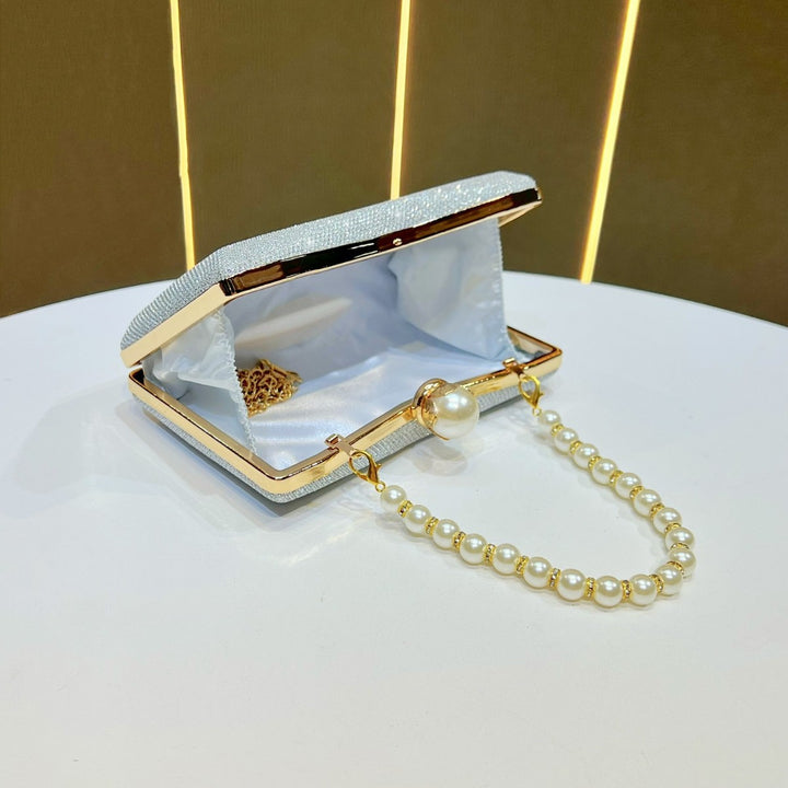 rhinestone-embellished evening clutch