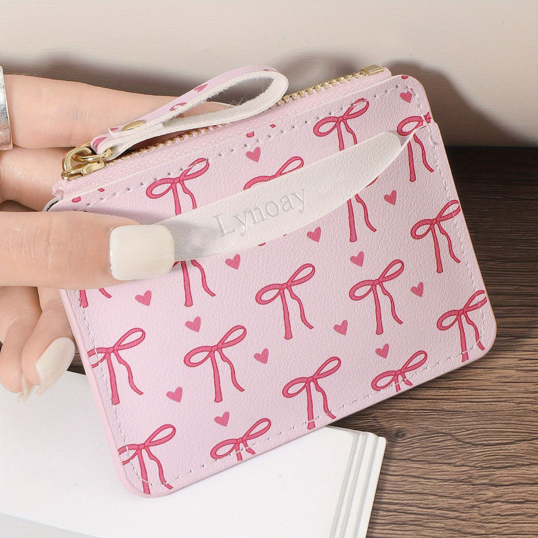 Compact bow-print coin purse wristlet with zipper closure Bowlift