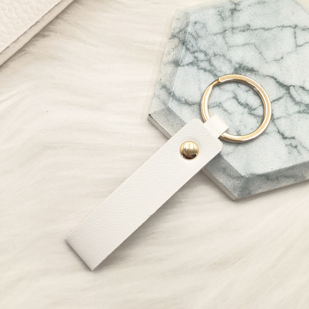 Unisex keychain made of high-quality synthetic leather with elegant metal embellishment Bowlift