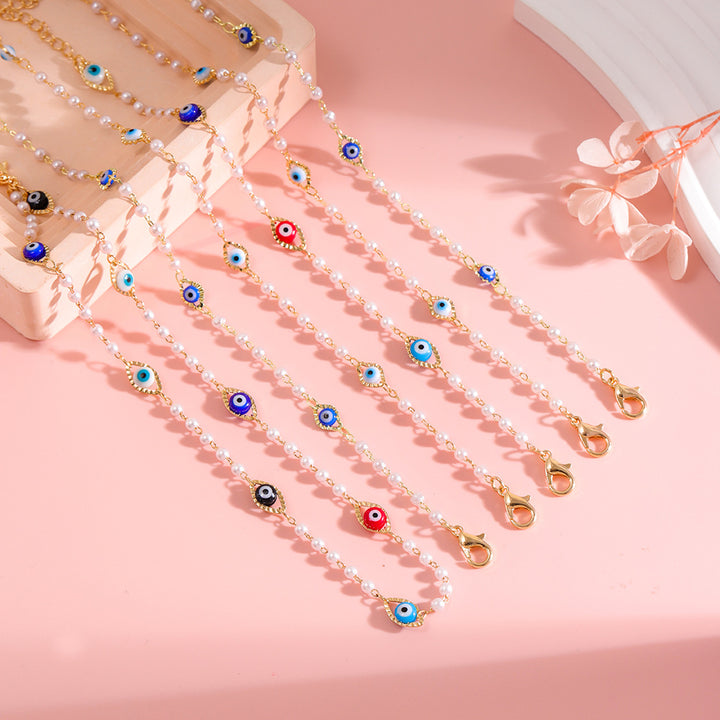 Elegant Pearl and Eye Charm Necklace Bowlift