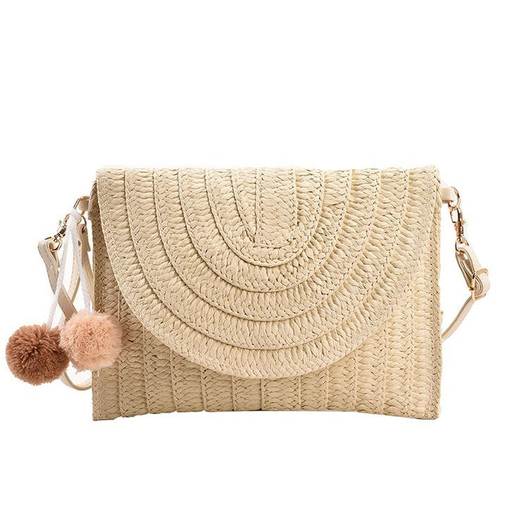 Braided shoulder bag with creative pom poms Bowlift