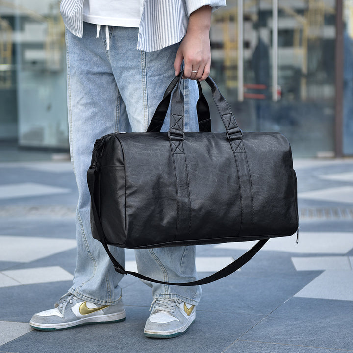 Travel bag made of high-quality leather with robust carrying handles Bowlift