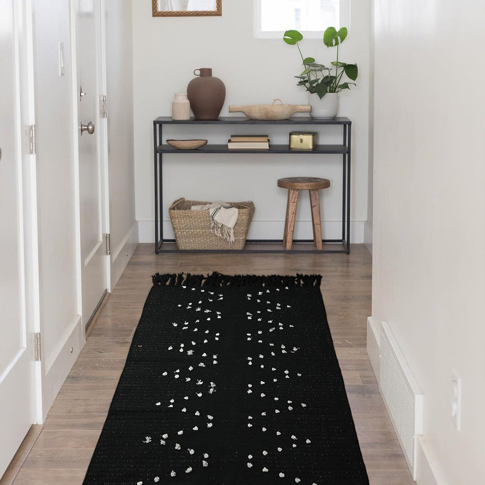 handwoven living room rug with fringes and geometric perforated pattern Bowlift