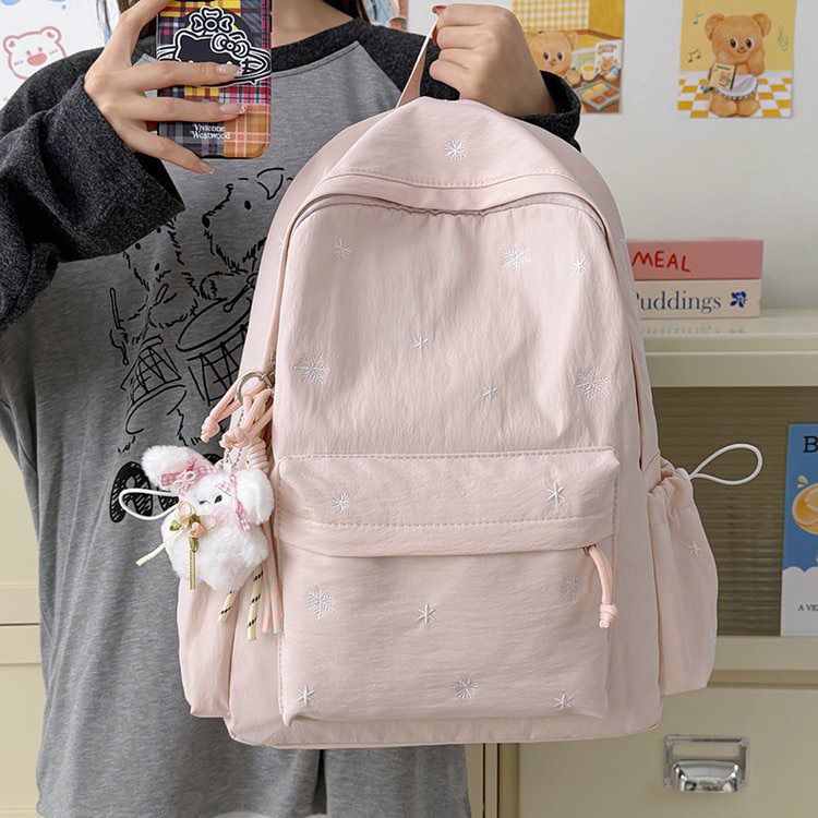 Playful backpack with fine embroidery Bowlift
