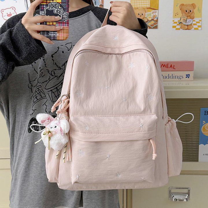 Playful backpack with fine embroidery Bowlift