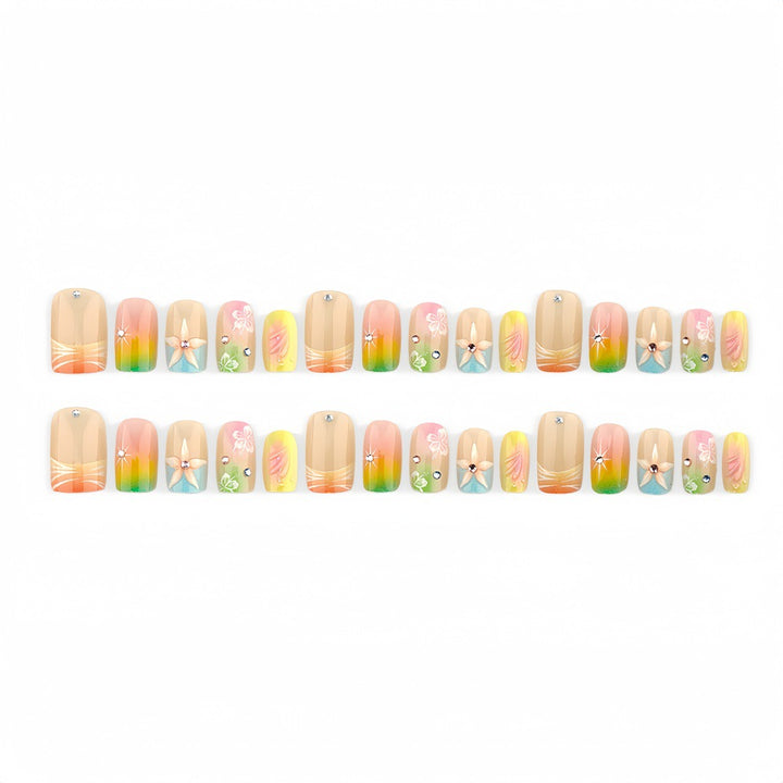 Artificial nails in vibrant floral design with glitter accents Bowlift