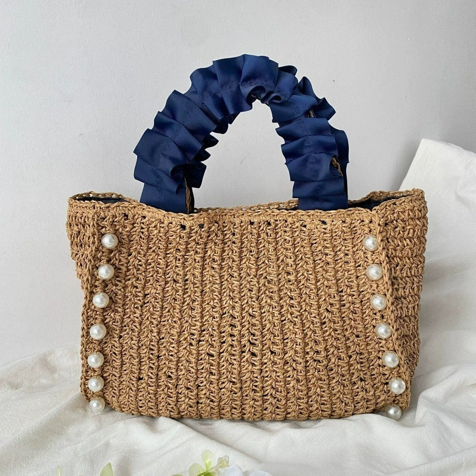 Fashionable straw bag with ruffle detail Bowlift