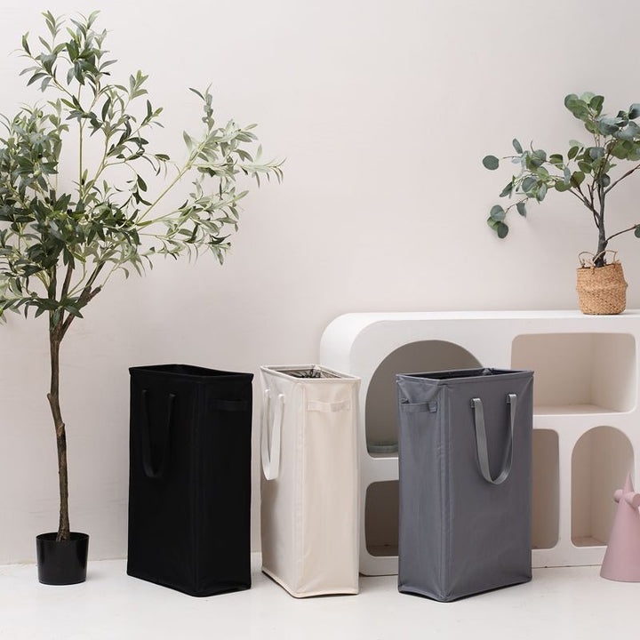 Elegant laundry basket with practical carrying handle Bowlift