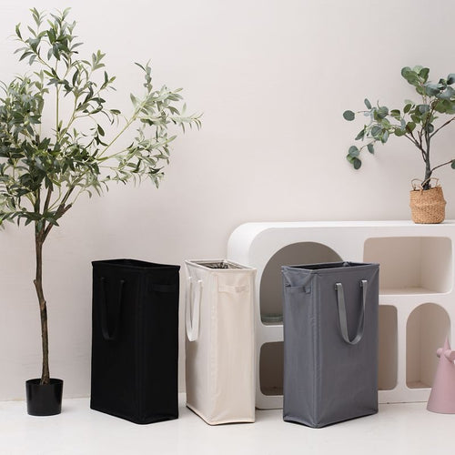 Elegant laundry basket with practical carrying handle Bowlift