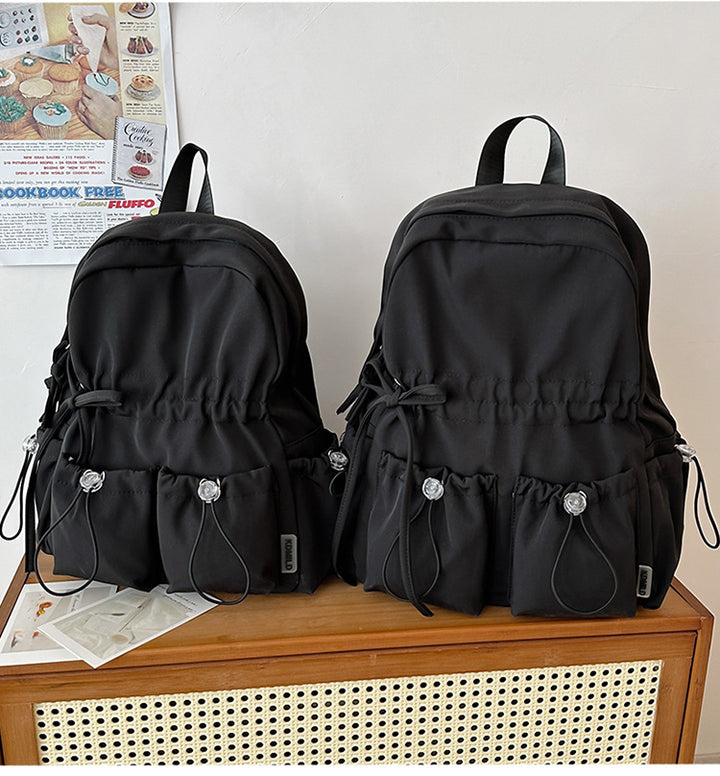 City backpack with innovative compartment system and adjustable carrying straps Bowlift