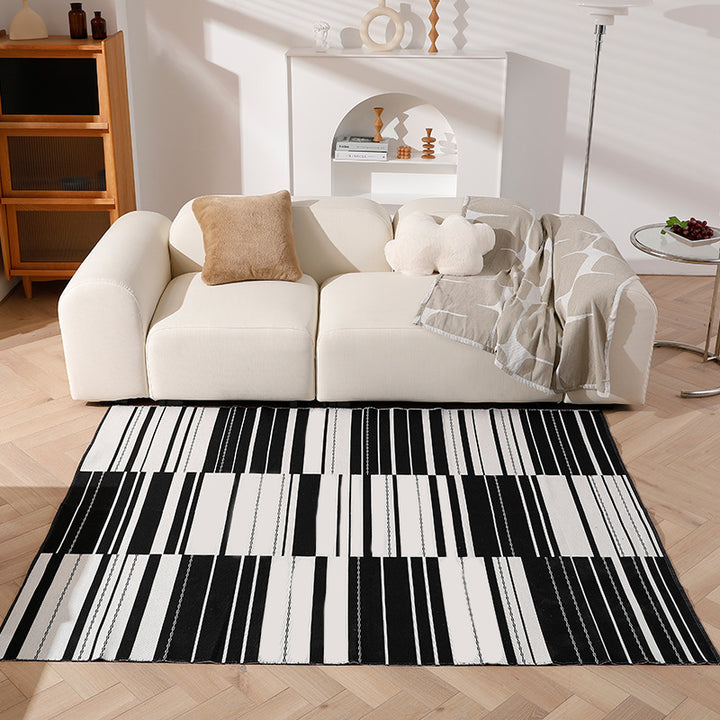 Geometric flat-woven living room rug with stripe and tile pattern