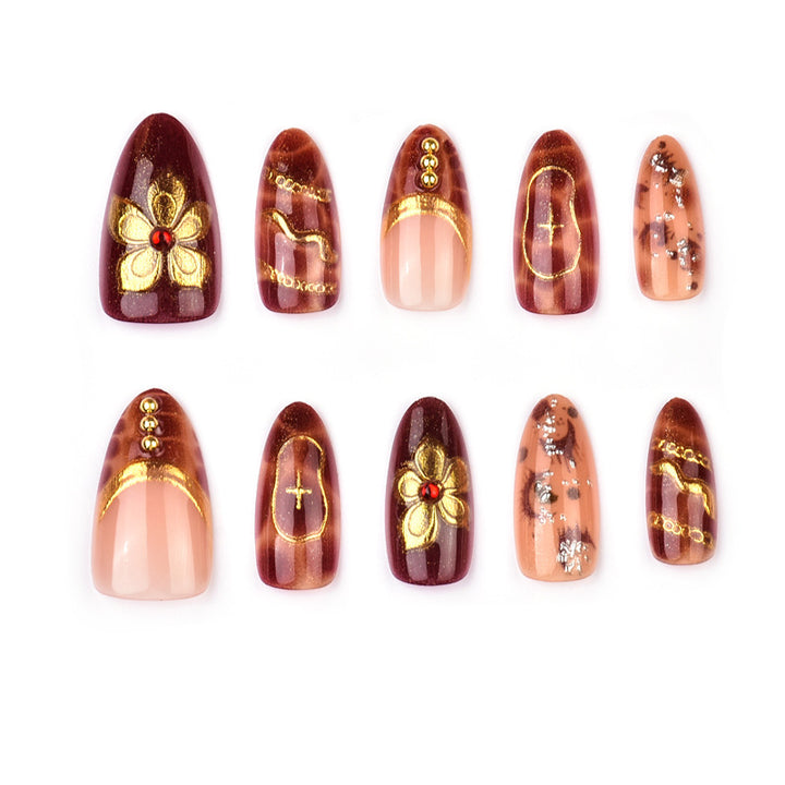 Deluxe artificial nails with golden accents Bowlift