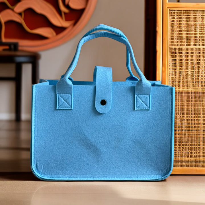 Structured felt tote bag with reinforced handles and organized interior Bowlift