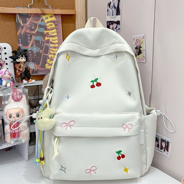 Playful backpack with embroidery Bowlift