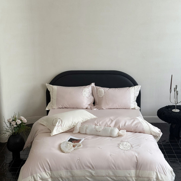 Noble cotton satin bed linen set with delicate rosette embroidery and decorative cushion roll Bowlift