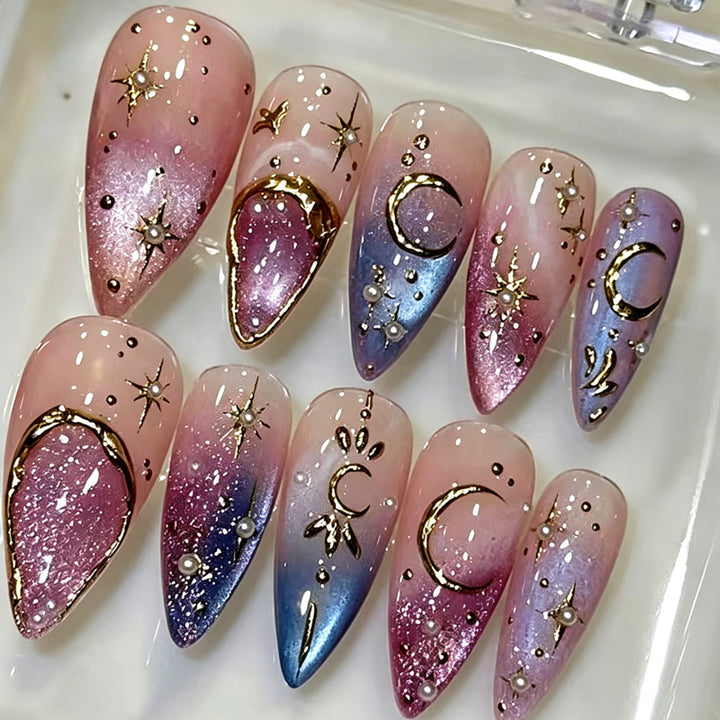 Glamorous artificial nails with star and moon motifs Bowlift