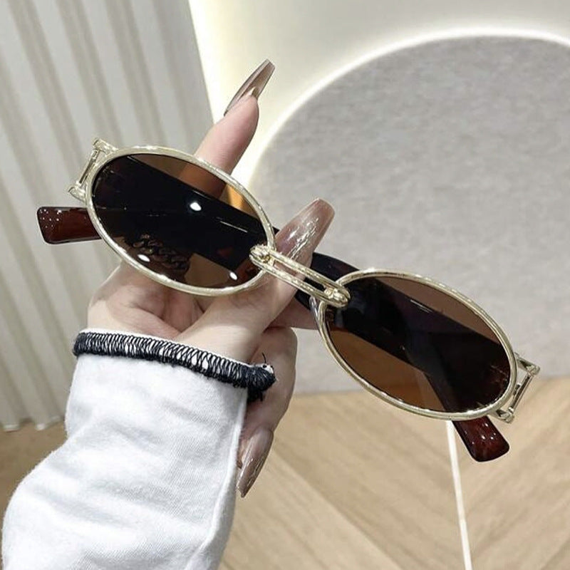 Women oval-shaped sunglasses with golden accents and stylish frame Bowlift