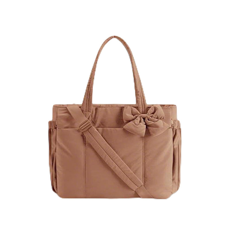 Practical tote bag with retractable shoulder strap and fashionable bow Bowlift