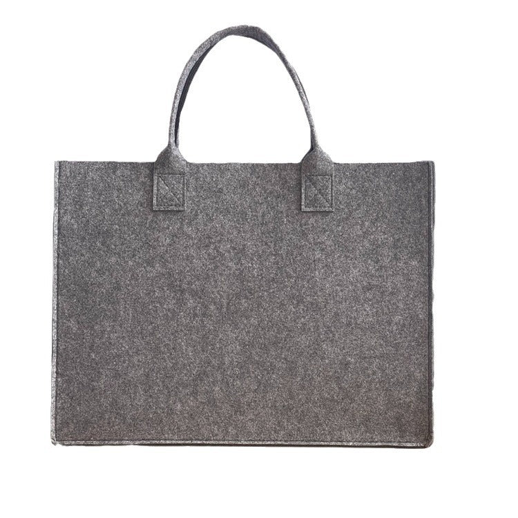 Structured felt tote bag with reinforced handles and organized interior Bowlift