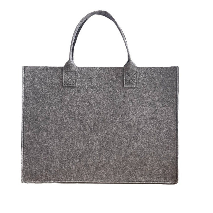 Structured felt tote bag with reinforced handles and organized interior Bowlift