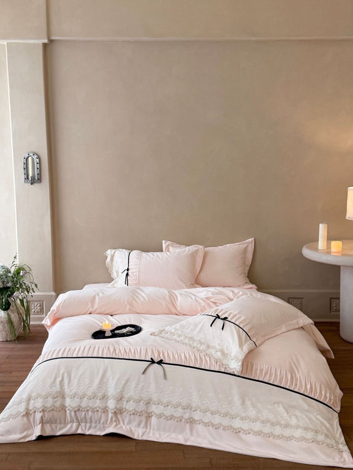 Romantic cotton satin bed linen set with ruffled hem, lace trim and decorative ribbons Bowlift