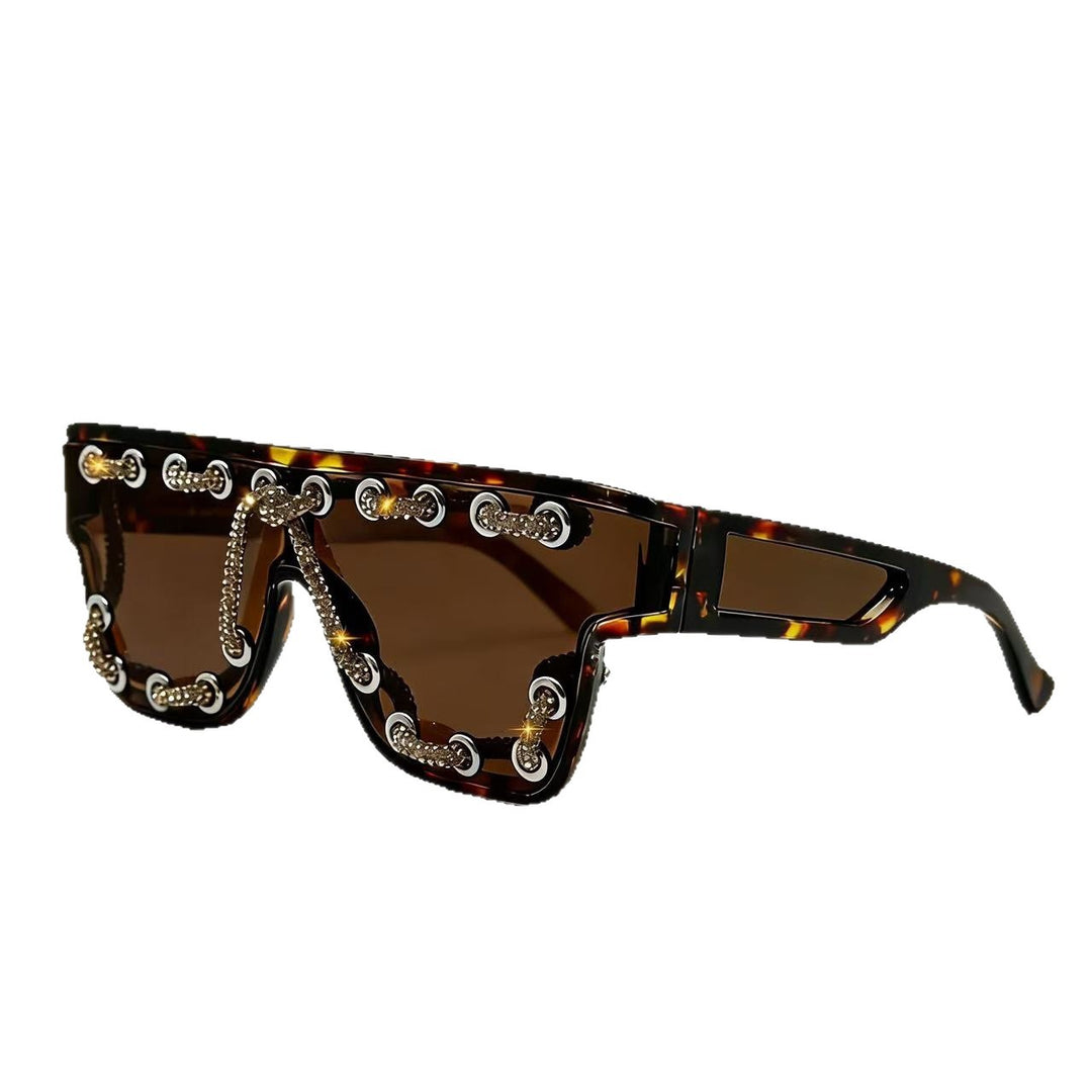 Ladies sunglasses with extravagant design and decorative chain embellishment Bowlift