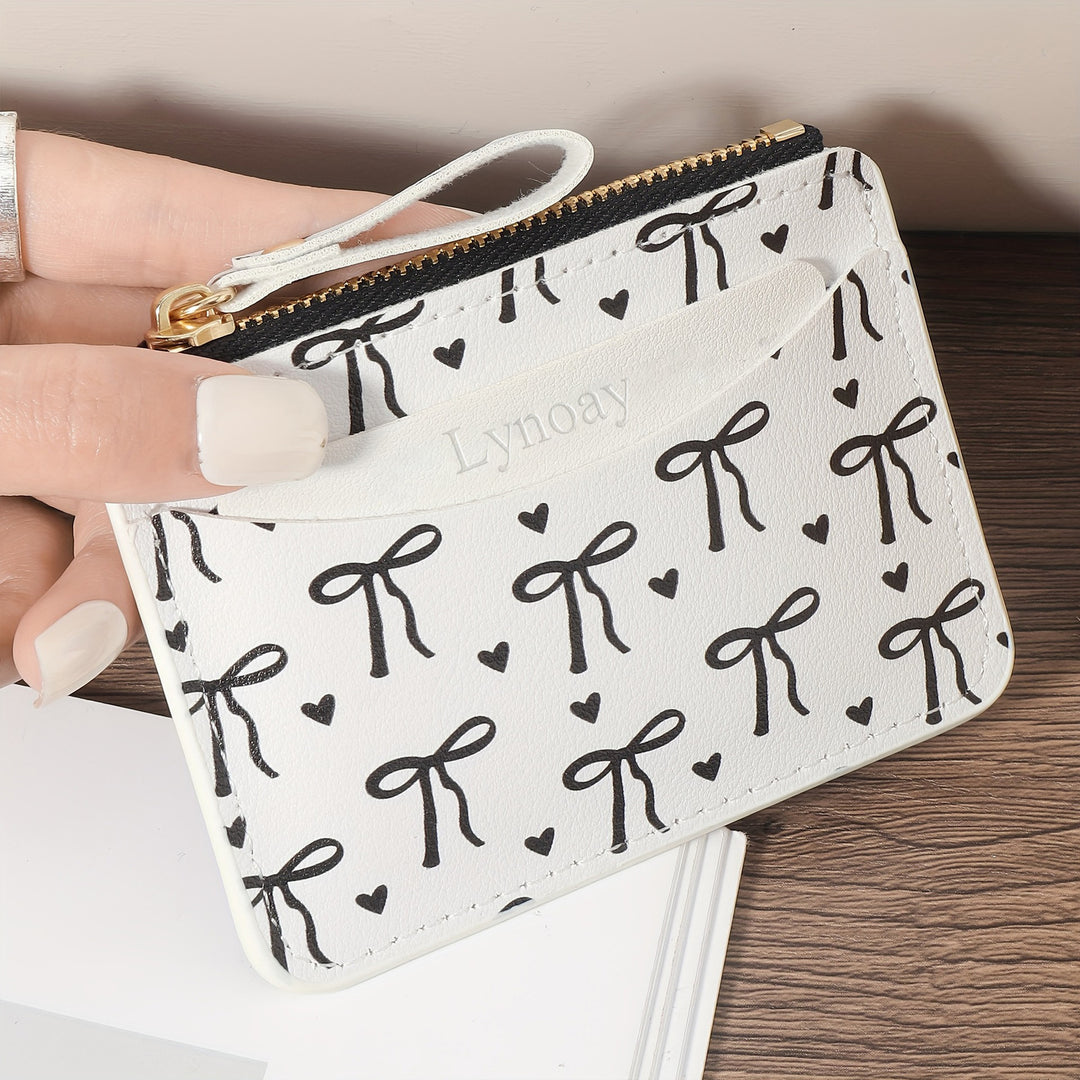 Compact bow-print coin purse wristlet with zipper closure Bowlift